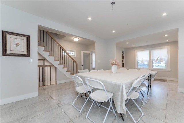1064 Highland Pl, Woodmere, NY 11598 - dining room featuring stairs, healthy amount of natural light, recessed lighting, baseboards, and light tile patterned floors