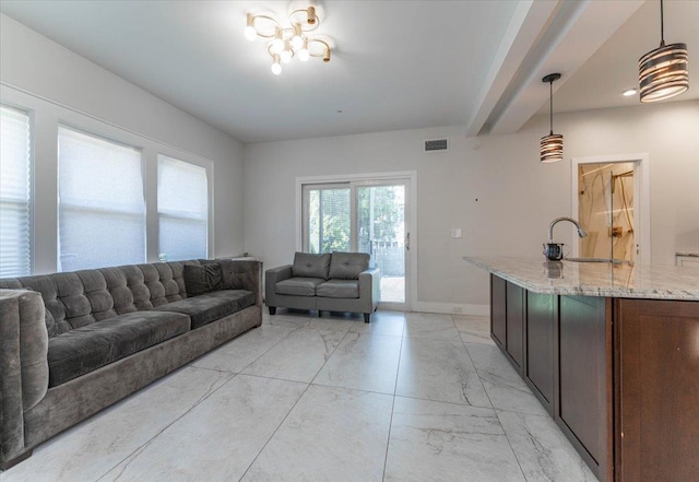 1064 Highland Pl, Woodmere, NY 11598 - living area featuring light marble finish flooring and baseboards