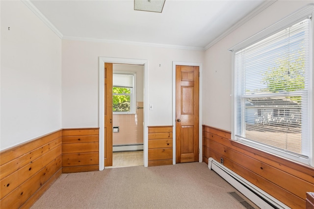 46 Tuthill Point Rd, East Moriches, NY 11940 - unfurnished bedroom featuring wainscoting, baseboard heating, a baseboard heating unit, wood walls, and light carpet