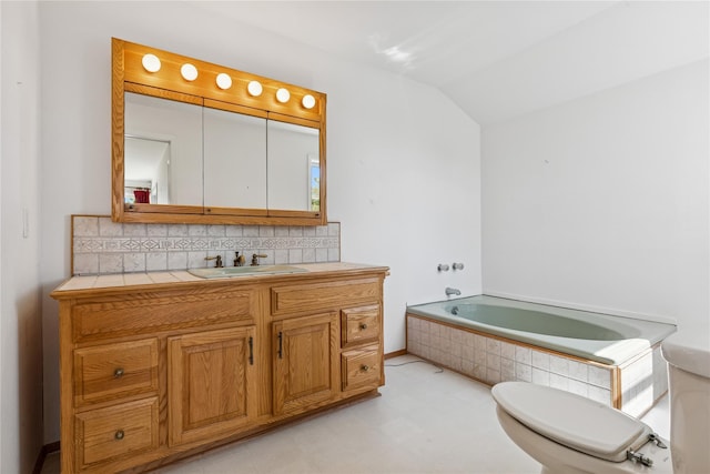 46 Tuthill Point Rd, East Moriches, NY 11940 - full bath with backsplash, toilet, a garden tub, vaulted ceiling, and vanity