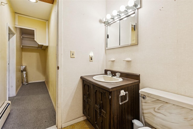 46 Tuthill Point Rd, East Moriches, NY 11940 - bathroom featuring a baseboard radiator, vanity, baseboards, and toilet