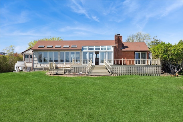 46 Tuthill Point Rd, East Moriches, NY 11940 - rear view of property featuring a chimney, a deck, and a yard
