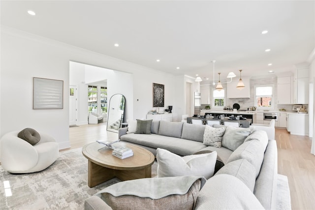 50 Depot Rd, Westhampton Beach, NY 11978 - living room with light wood finished floors, recessed lighting, and ornamental molding