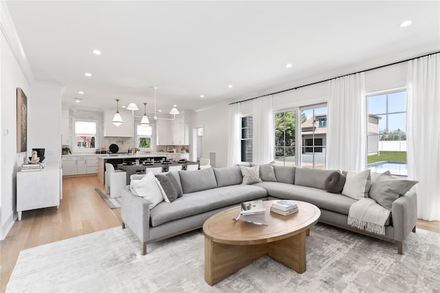 50 Depot Rd, Westhampton Beach, NY 11978 - living room with recessed lighting, light wood-type flooring, and crown molding