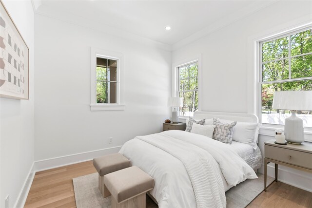 50 Depot Rd, Westhampton Beach, NY 11978 - bedroom with light wood-style floors, baseboards, ornamental molding, and recessed lighting