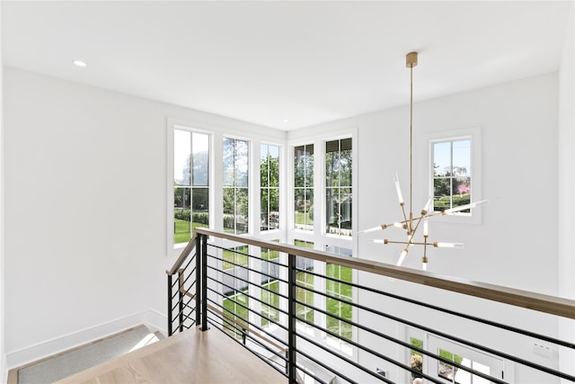 50 Depot Rd, Westhampton Beach, NY 11978 - hallway featuring an upstairs landing, baseboards, a chandelier, and recessed lighting