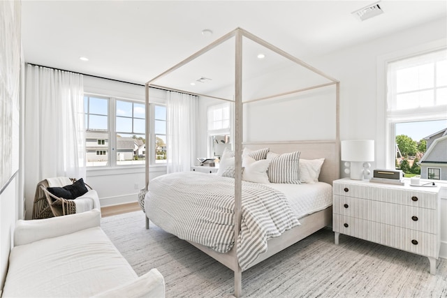 50 Depot Rd, Westhampton Beach, NY 11978 - bedroom with recessed lighting and light wood-style floors