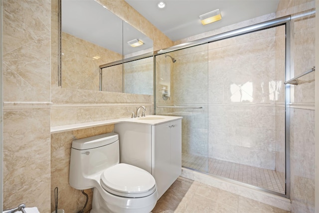 270-10 Grand Central Pkwy Unit 11V, Floral Park, NY 11005 - bathroom featuring tile walls, vanity, toilet, a shower stall, and recessed lighting