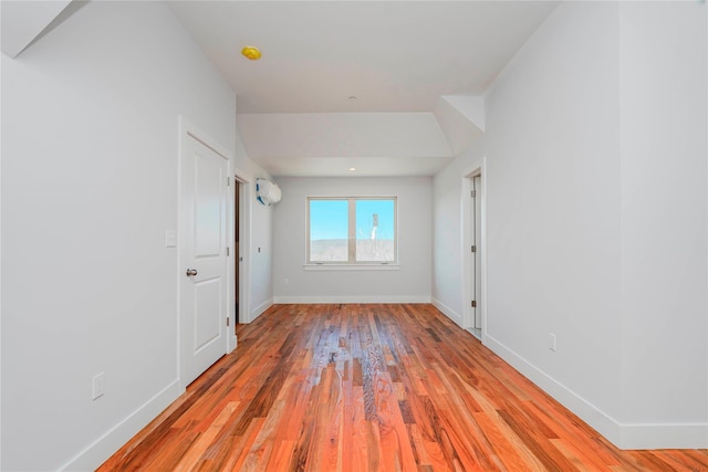 unfurnished room featuring baseboards and light wood-style flooring