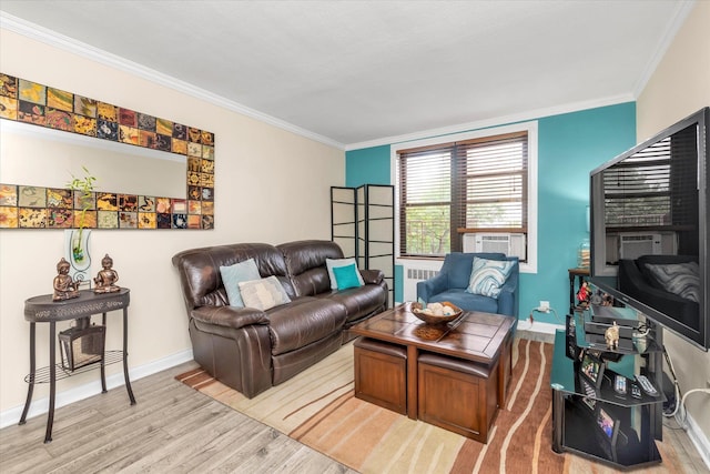 150-10 71st Ave Unit 6H, Kew Garden Hills, NY 11367 - living area with wood finished floors, crown molding, baseboards, and radiator heating unit