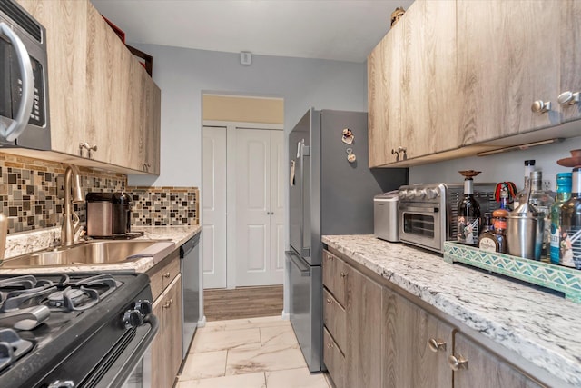150-10 71st Ave Unit 6H, Kew Garden Hills, NY 11367 - kitchen with appliances with stainless steel finishes, light marble finish floors, tasteful backsplash, light stone countertops, and light brown cabinets