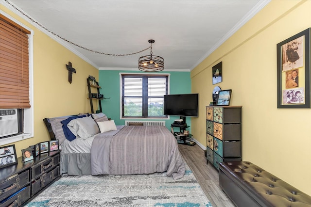 150-10 71st Ave Unit 6H, Kew Garden Hills, NY 11367 - bedroom with crown molding, wood finished floors, a chandelier, and baseboards