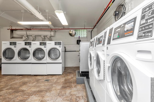 150-10 71st Ave Unit 6H, Kew Garden Hills, NY 11367 - community laundry featuring separate washer and dryer and stone finish flooring
