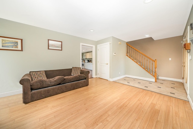 2874 Shore Rd, Seaford, NY 11783 - living area featuring hardwood / wood-style flooring, stairs, baseboards, and recessed lighting