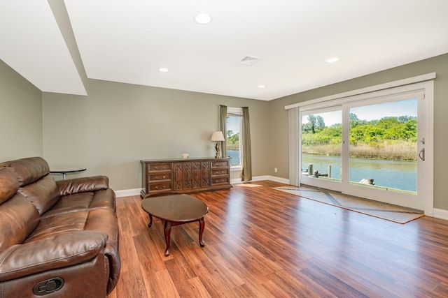 2874 Shore Rd, Seaford, NY 11783 - living area featuring wood finished floors, baseboards, and recessed lighting