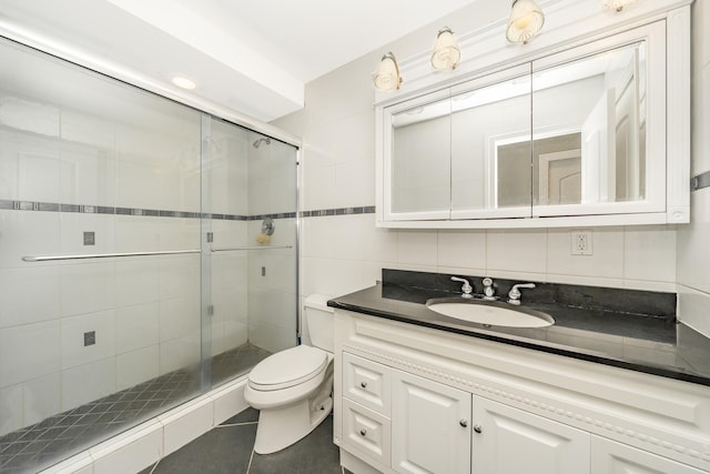 2874 Shore Rd, Seaford, NY 11783 - bathroom featuring vanity, tile patterned flooring, a stall shower, toilet, and tile walls