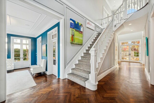 4 Warton Pl, Garden City, NY 11530 - foyer featuring french doors, stairs, crown molding, and baseboards