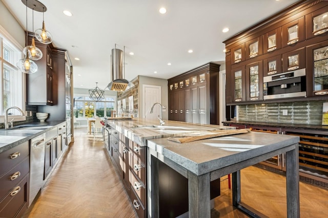 4 Warton Pl, Garden City, NY 11530 - kitchen featuring a sink, dishwasher, a large island, recessed lighting, and island range hood
