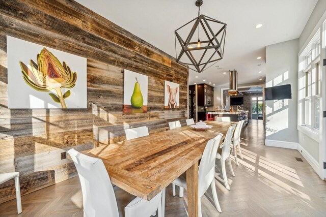 4 Warton Pl, Garden City, NY 11530 - dining room with wood walls, recessed lighting, a chandelier, and baseboards