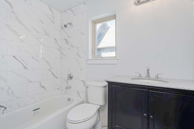 bathroom with vanity, toilet, and shower / tub combination
