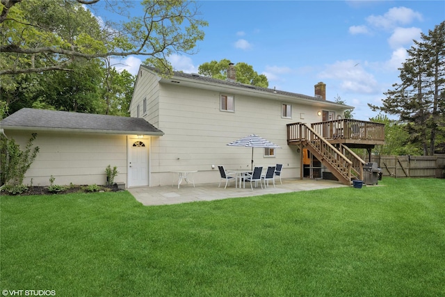 475 Lilac Ln, Cutchogue, NY 11935 - rear view of house with a wooden deck, stairs, a chimney, and a patio area