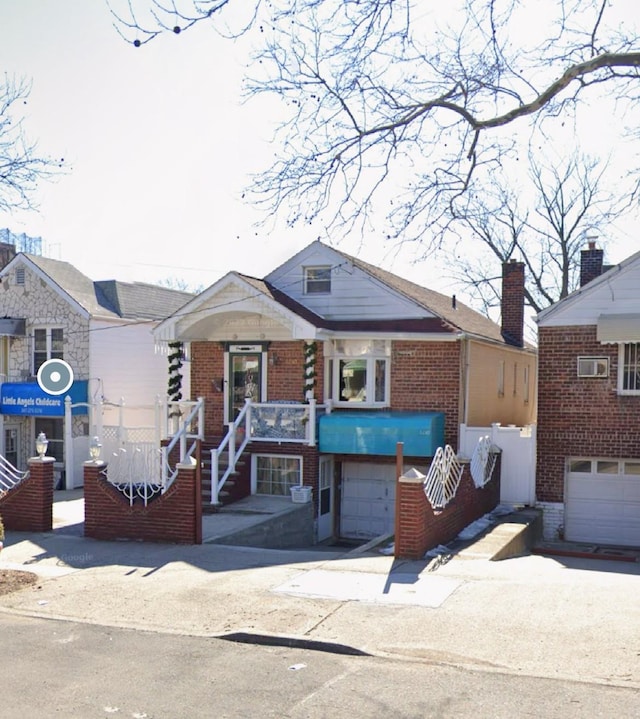 1230 Arnow Ave, Bronx, NY 10469 - bungalow-style house featuring a garage and brick siding