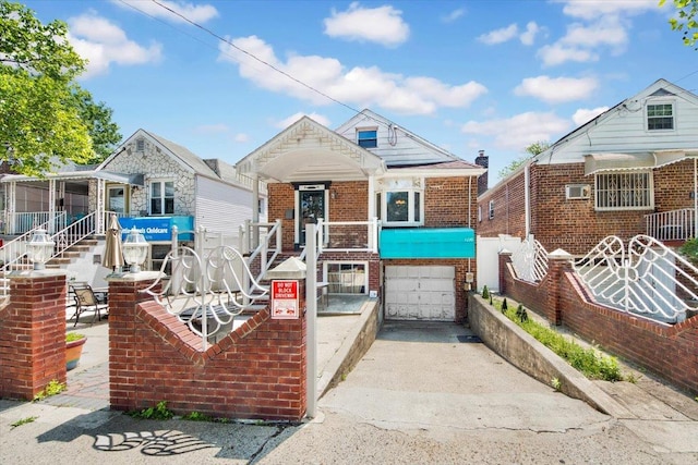1230 Arnow Ave, Bronx, NY 10469 - view of front of home featuring brick siding, concrete driveway, and an attached garage