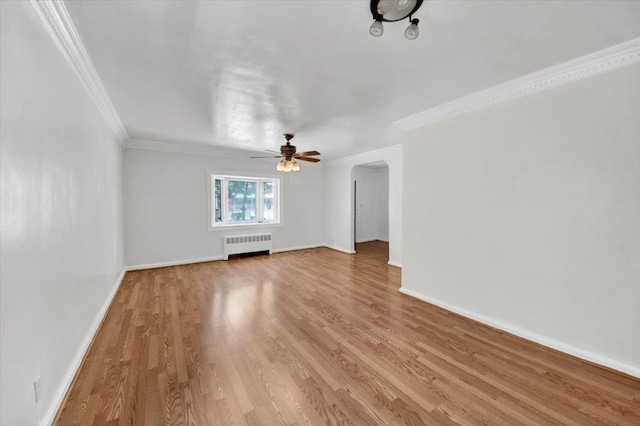 1230 Arnow Ave, Bronx, NY 10469 - unfurnished living room featuring radiator, crown molding, light wood-type flooring, a ceiling fan, and baseboards