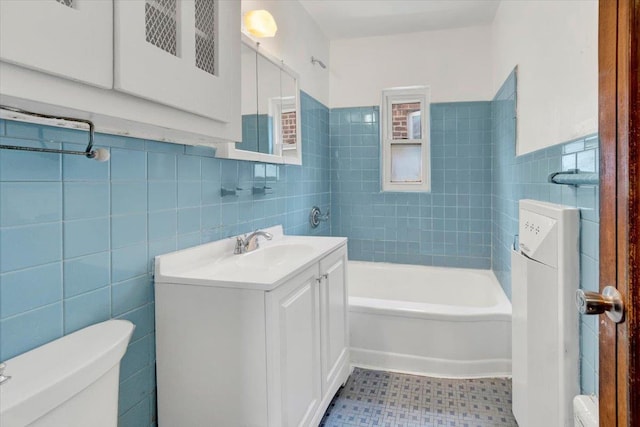 1230 Arnow Ave, Bronx, NY 10469 - full bath with toilet, tile walls, vanity, a bath, and a wainscoted wall
