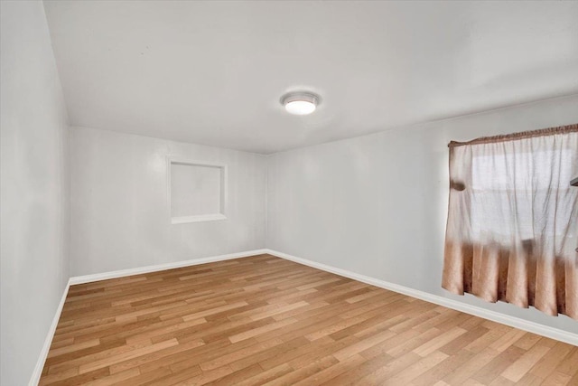 1230 Arnow Ave, Bronx, NY 10469 - unfurnished room with light wood-style flooring and baseboards
