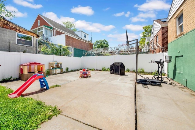 1230 Arnow Ave, Bronx, NY 10469 - fenced backyard with a patio area