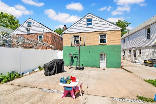 1230 Arnow Ave, Bronx, NY 10469 - back of house with a patio area, a fenced backyard, and stucco siding