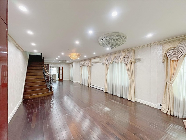15204 79th Ave, Kew Garden Hills, NY 11367 - unfurnished living room with a wall unit AC, baseboards, stairs, wood-type flooring, and recessed lighting