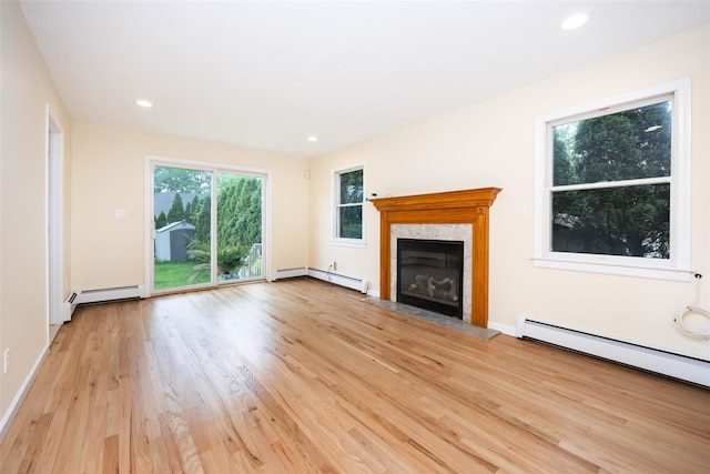 247 Marcus Ave, New Hyde Park, NY 11040 - unfurnished living room featuring a baseboard radiator, light wood finished floors, a fireplace, recessed lighting, and a baseboard heating unit