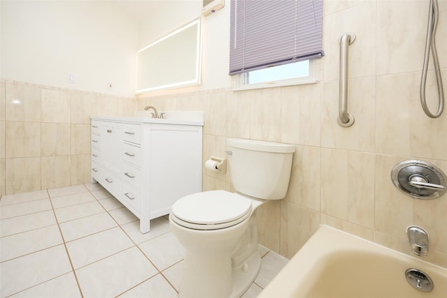 247 Marcus Ave, New Hyde Park, NY 11040 - bathroom featuring tile walls, toilet, tile patterned flooring, vanity, and a wainscoted wall
