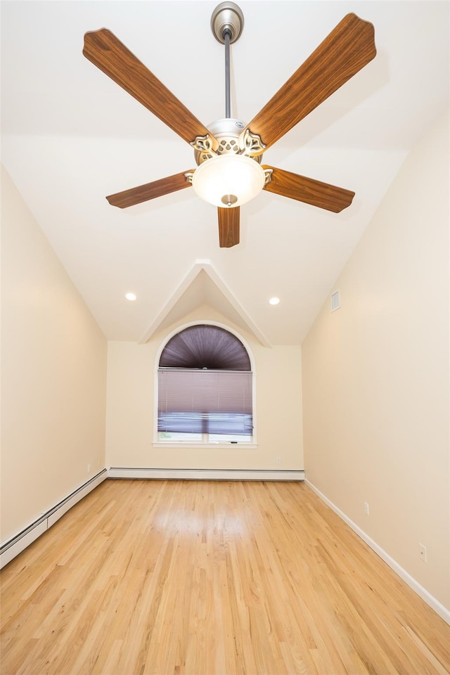 247 Marcus Ave, New Hyde Park, NY 11040 - spare room with wood finished floors, ceiling fan, lofted ceiling, a baseboard radiator, and baseboards
