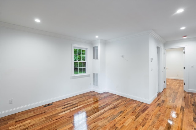 381 Wading River Rd, Manorville, NY 11949 - empty room with light wood-style floors, baseboards, recessed lighting, and ornamental molding