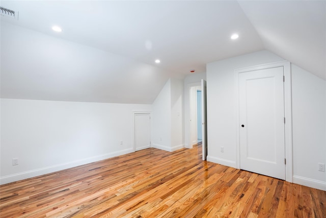 381 Wading River Rd, Manorville, NY 11949 - additional living space featuring vaulted ceiling, light wood-type flooring, recessed lighting, and baseboards