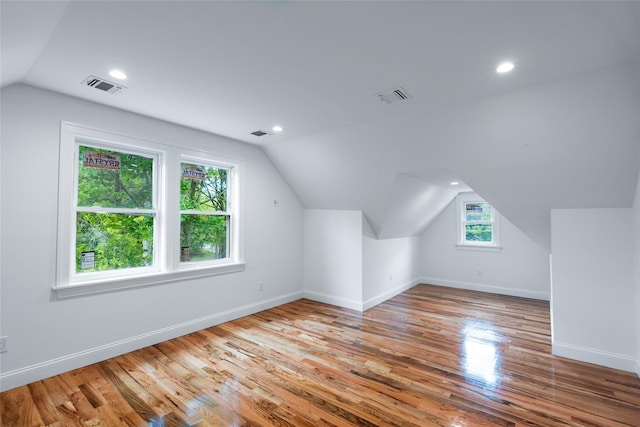 381 Wading River Rd, Manorville, NY 11949 - bonus room with vaulted ceiling, baseboards, wood finished floors, and recessed lighting
