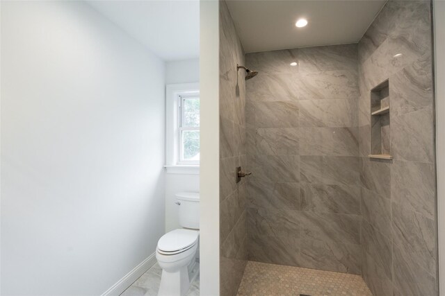 381 Wading River Rd, Manorville, NY 11949 - full bath with toilet, tiled shower, recessed lighting, baseboards, and marble finish flooring