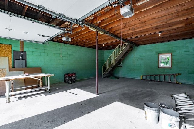 381 Wading River Rd, Manorville, NY 11949 - below grade area featuring a workshop area, concrete block wall, and stairway