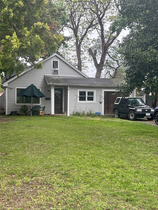 9 Sprucewood Rd, West Babylon, NY 11704 - bungalow-style home featuring a front lawn and a garage