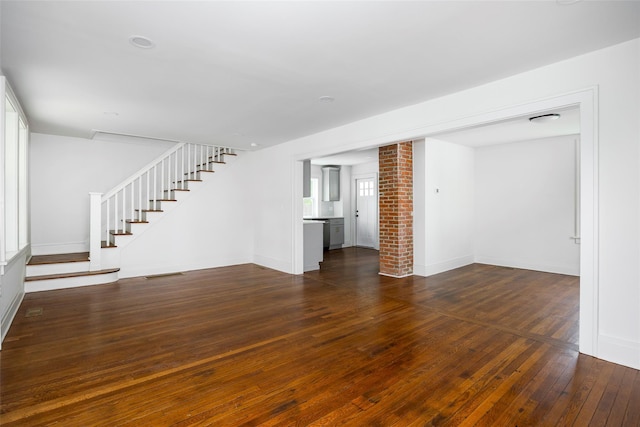 8 S Maple Ave, Millerton, NY 12546 - unfurnished living room with stairway, hardwood / wood-style flooring, and baseboards