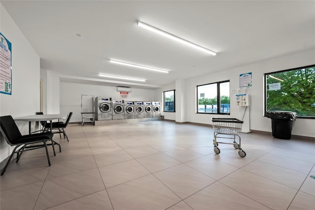 interior space with tile patterned floors, stacked washing machine and dryer, separate washer and dryer, and baseboards