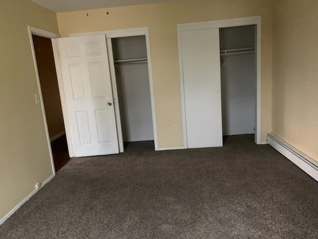 5-7 Barbara Ln, Farmingdale, NY 11735 - unfurnished bedroom featuring multiple closets, carpet floors, and baseboard heating