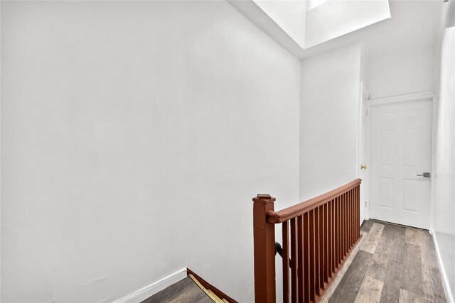 stairway with wood finished floors