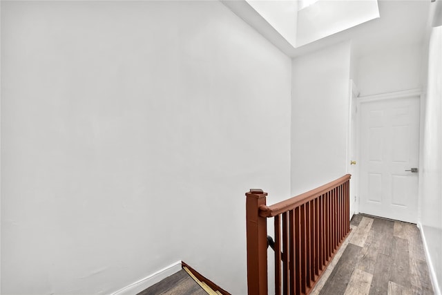 stairway with wood finished floors