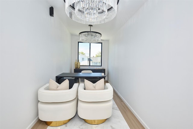 929 Jewel Dr, North Woodmere, NY 11581 - dining area with a chandelier, baseboards, and light wood-type flooring