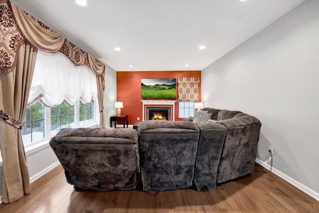 26 Kyleigh Way, Middletown, NY 10940 - living room with wood finished floors, baseboards, a warm lit fireplace, and recessed lighting