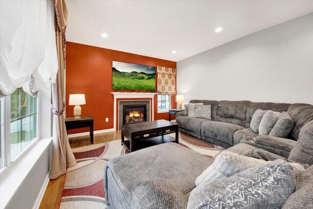 26 Kyleigh Way, Middletown, NY 10940 - living area featuring wood finished floors, baseboards, recessed lighting, and a lit fireplace